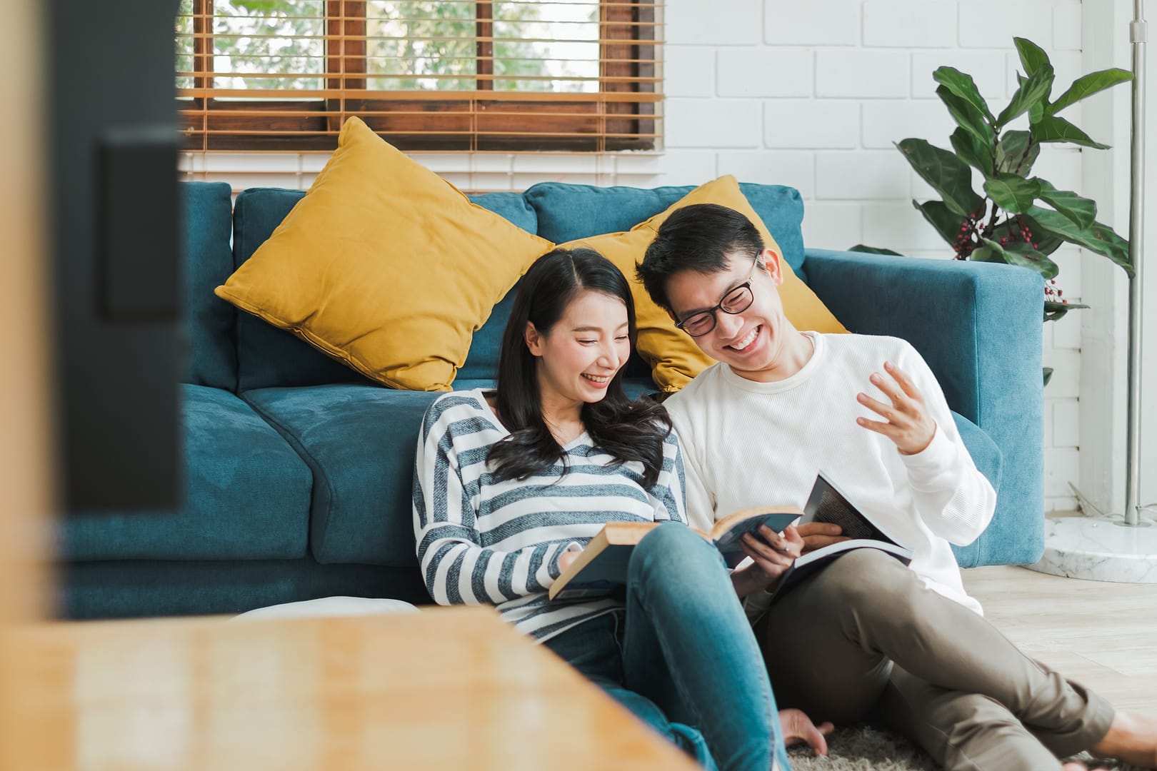 Asian couple man and woman talking working  spend time together at home, Asian couple family lifestyle concept