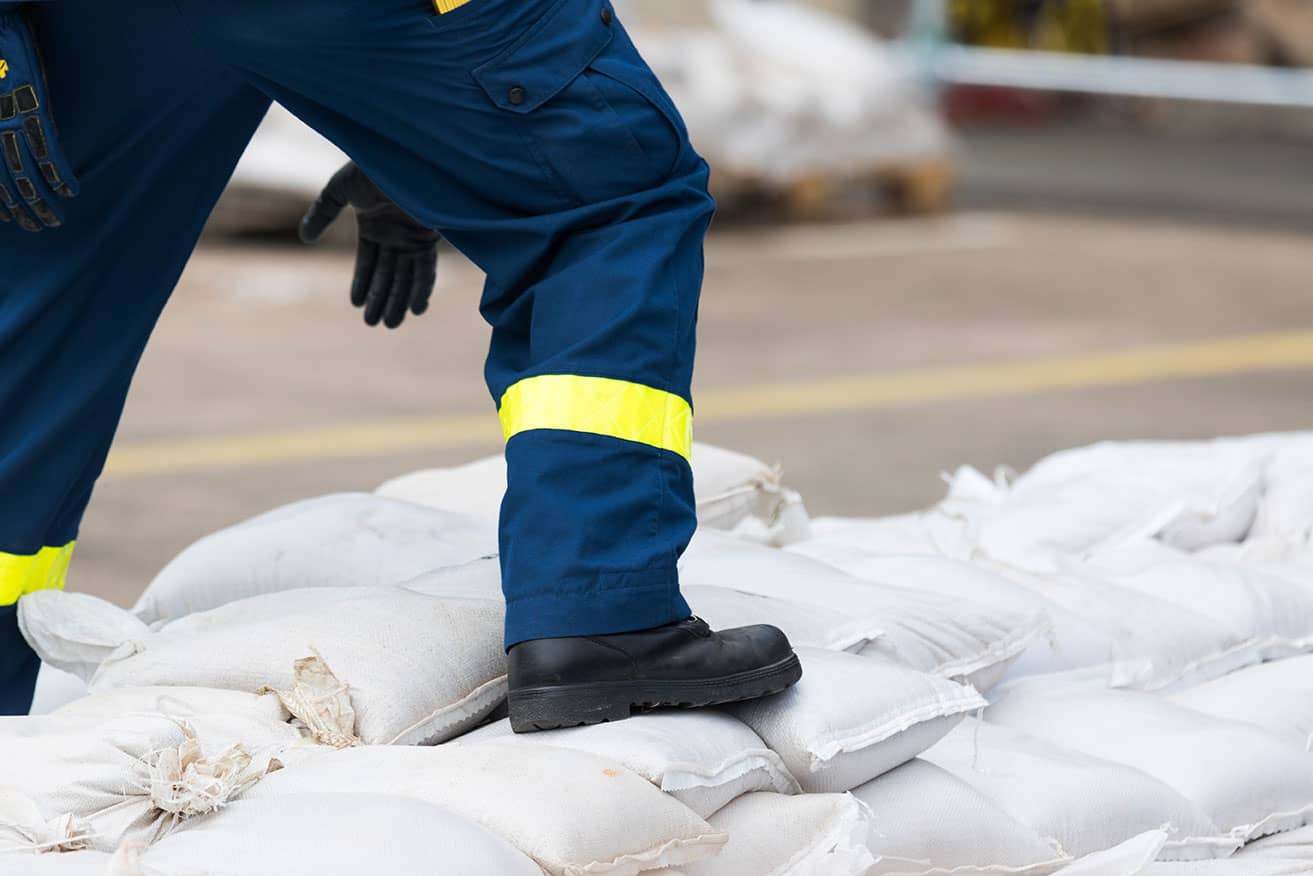 Person standing on sandbags